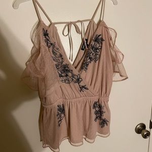 Peach with black felt detail and lace sleeves cross body tank top